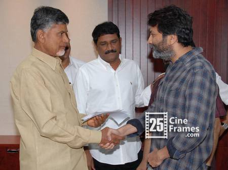 Trivikram hands over 10 Lakhs Rupees cheque to Chandrababu Naidu