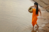 Archana latest Hot Wet in Rain Photos in Orange dress 25CineFrames