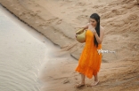 Archana latest Hot Wet in Rain Photos in Orange dress 25CineFrames