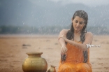 Archana latest Hot Wet in Rain Photos in Orange dress 25CineFrames