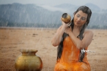 Archana latest Hot Wet in Rain Photos in Orange dress 25CineFrames