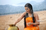 Archana latest Hot Wet in Rain Photos in Orange dress 25CineFrames