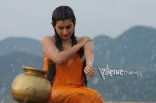 Archana latest Hot Wet in Rain Photos in Orange dress 25CineFrames