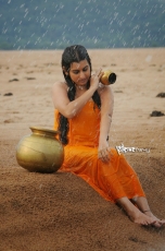 Archana latest Hot Wet in Rain Photos in Orange dress 25CineFrames