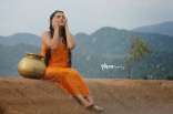 Archana latest Hot Wet in Rain Photos in Orange dress 25CineFrames