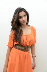 Actress Madhurima Cute in Orange Dress Photos Stills