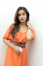 Actress Madhurima Cute in Orange Dress Photos Stills