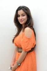 Actress Madhurima Cute in Orange Dress Photos Stills
