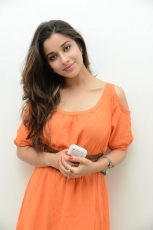 Actress Madhurima Cute in Orange Dress Photos Stills