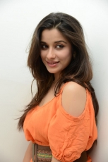 Actress Madhurima Cute in Orange Dress Photos Stills