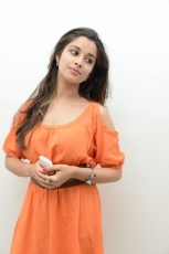 Actress Madhurima Cute in Orange Dress Photos Stills