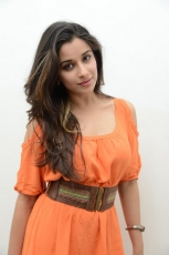 Actress Madhurima Cute in Orange Dress Photos Stills