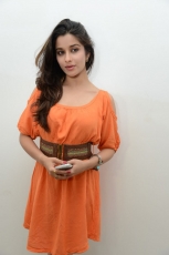 Actress Madhurima Cute in Orange Dress Photos Stills