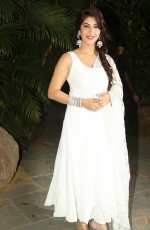 Sonarika Bhadoria New Latest HD Photos in White Dress at Jadoogadu Audio Launch