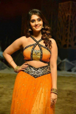 Surbhi Hot ULTRA HD Photos in Okka Kshanam Dillore Dillore Song | Surabhi Orange Dress Images Stills Gallery