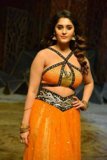 Surbhi Hot ULTRA HD Photos in Okka Kshanam Dillore Dillore Song | Surabhi Orange Dress Images Stills Gallery